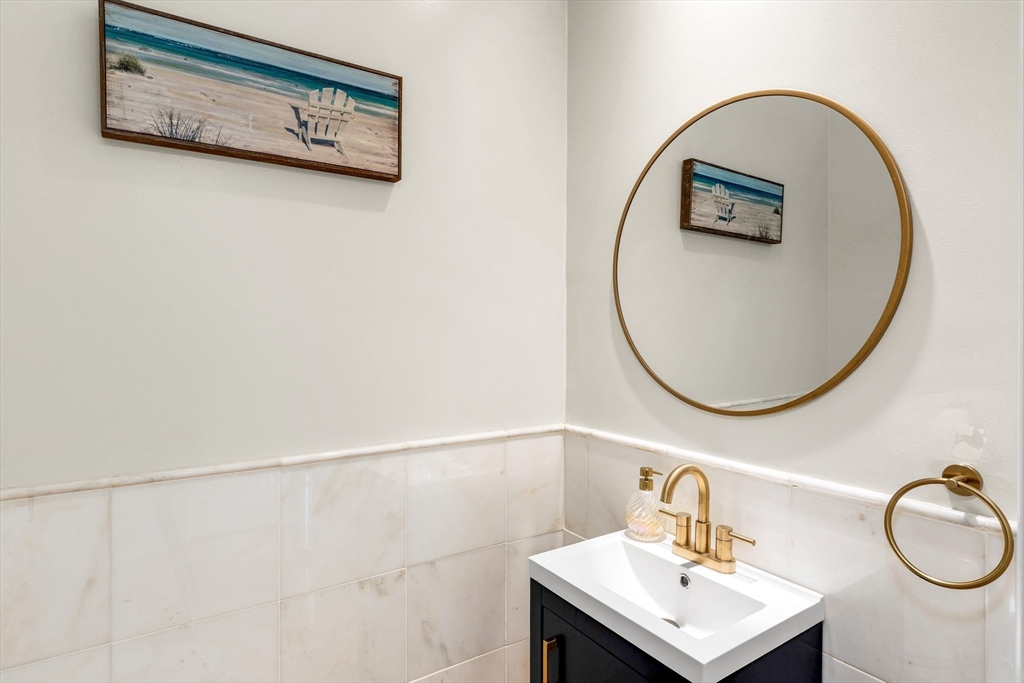 53 Emily Lane Rowley, MA 01969 - Photo 14 of 42 a bathroom with a sink and a mirror