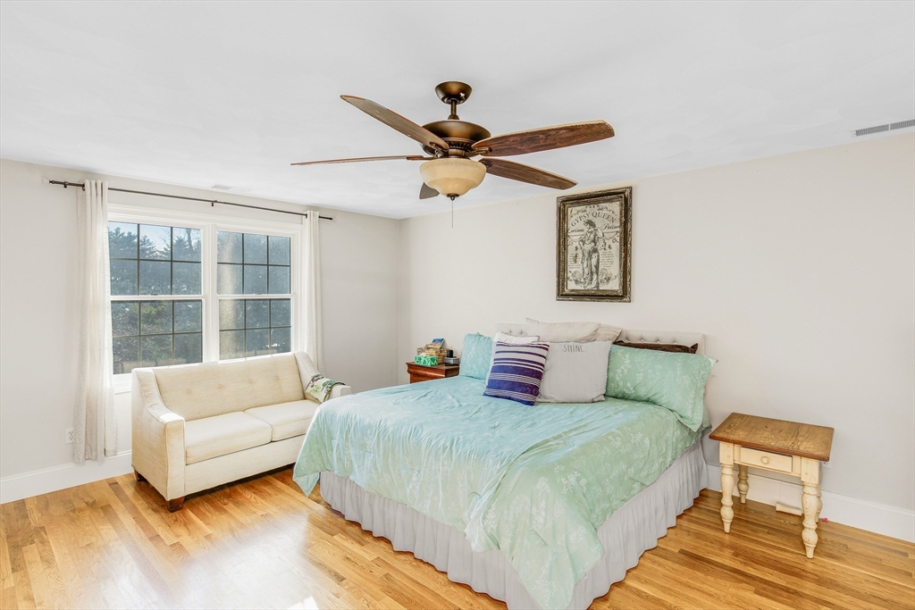 53 Emily Lane Rowley, MA 01969 - Photo 16 of 42 a bedroom with a bed couches and window