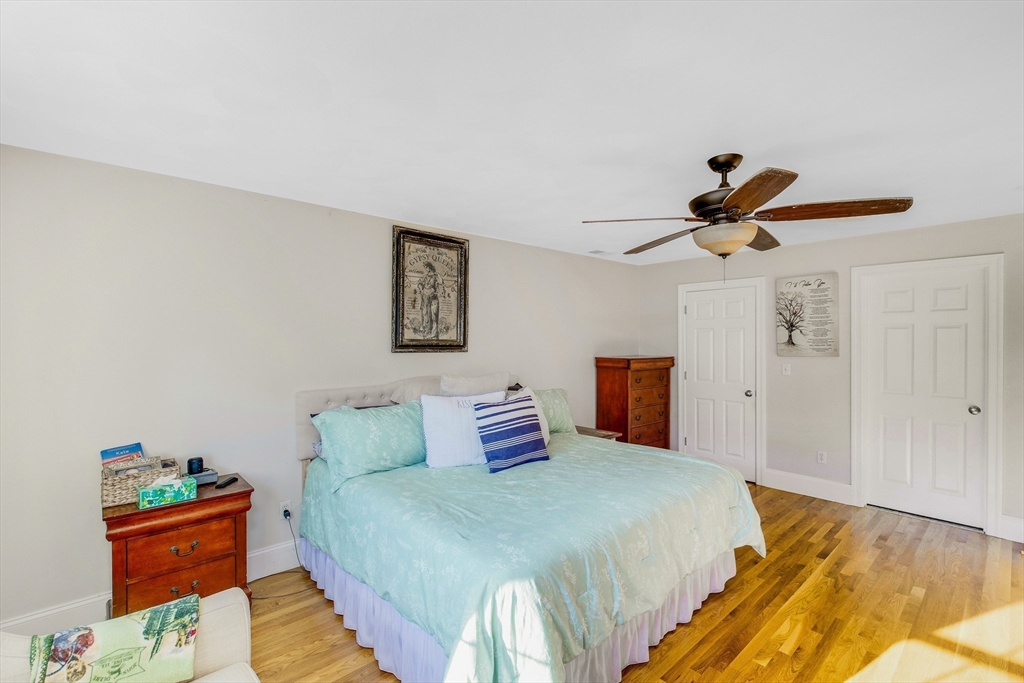 53 Emily Lane Rowley, MA 01969 - Photo 17 of 42 a bedroom with a bed and a painting on the wall