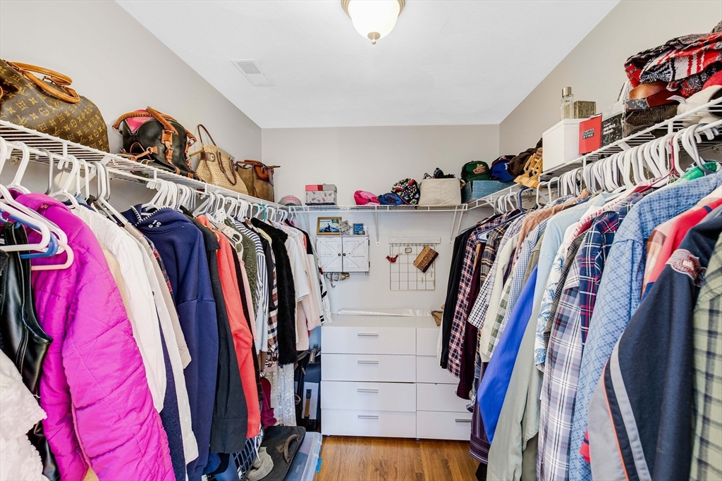 53 Emily Lane Rowley, MA 01969 - Photo 19 of 42 a view of walk in closet with clothes and shoes