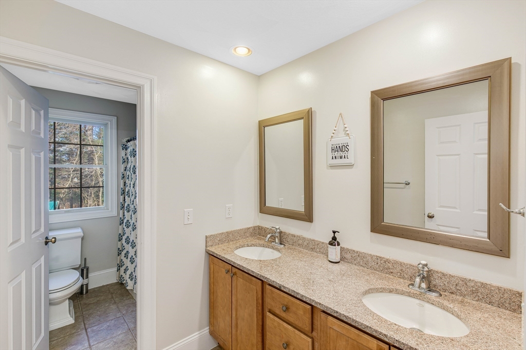 53 Emily Lane Rowley, MA 01969 - Photo 24 of 42 a bathroom with a granite countertop sink toilet and shower