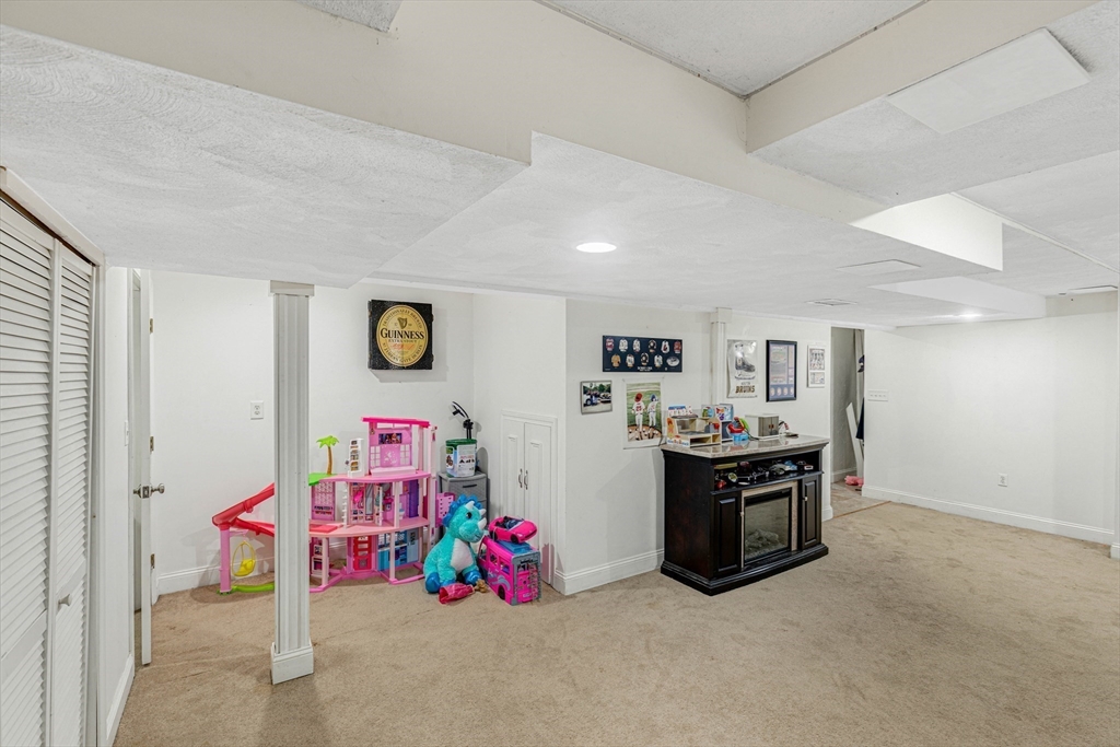 53 Emily Lane Rowley, MA 01969 - Photo 27 of 42 a view of livingroom with shelves