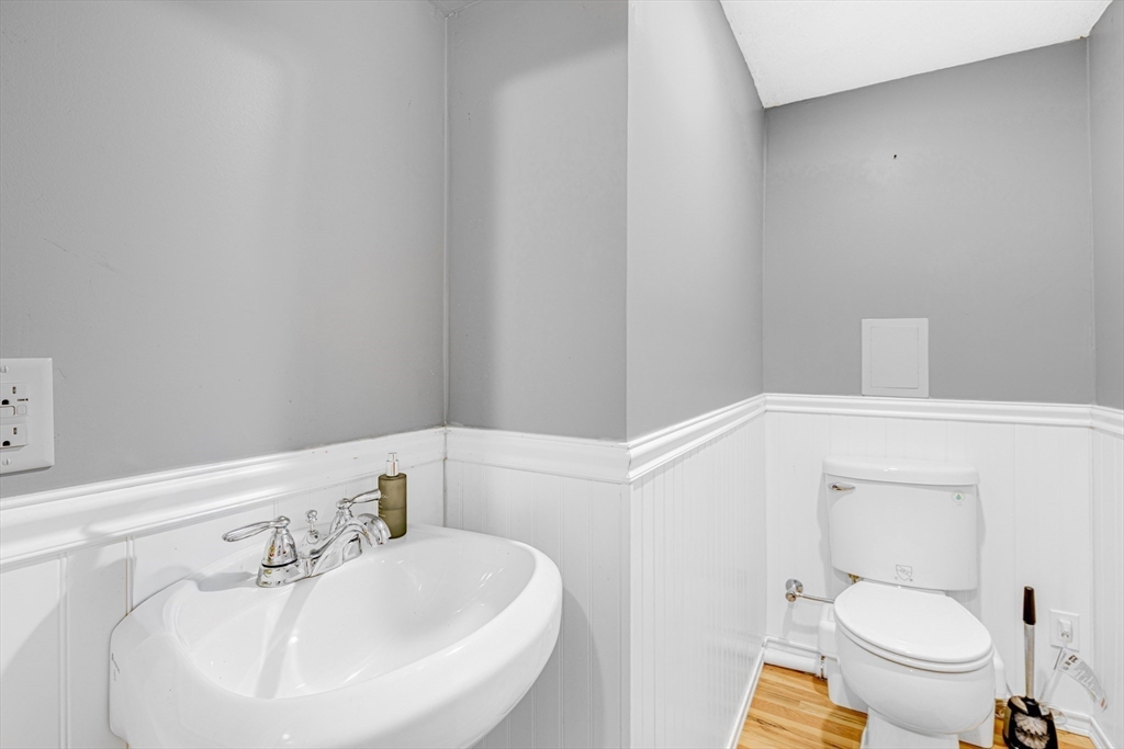 53 Emily Lane Rowley, MA 01969 - Photo 28 of 42 a bathroom with a sink a toilet and mirror