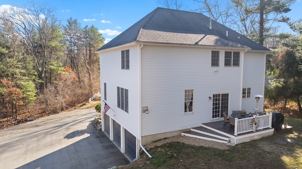 53 Emily Lane Rowley, MA 01969 - Photo 31 of 42 a view of a house with backyard and trees