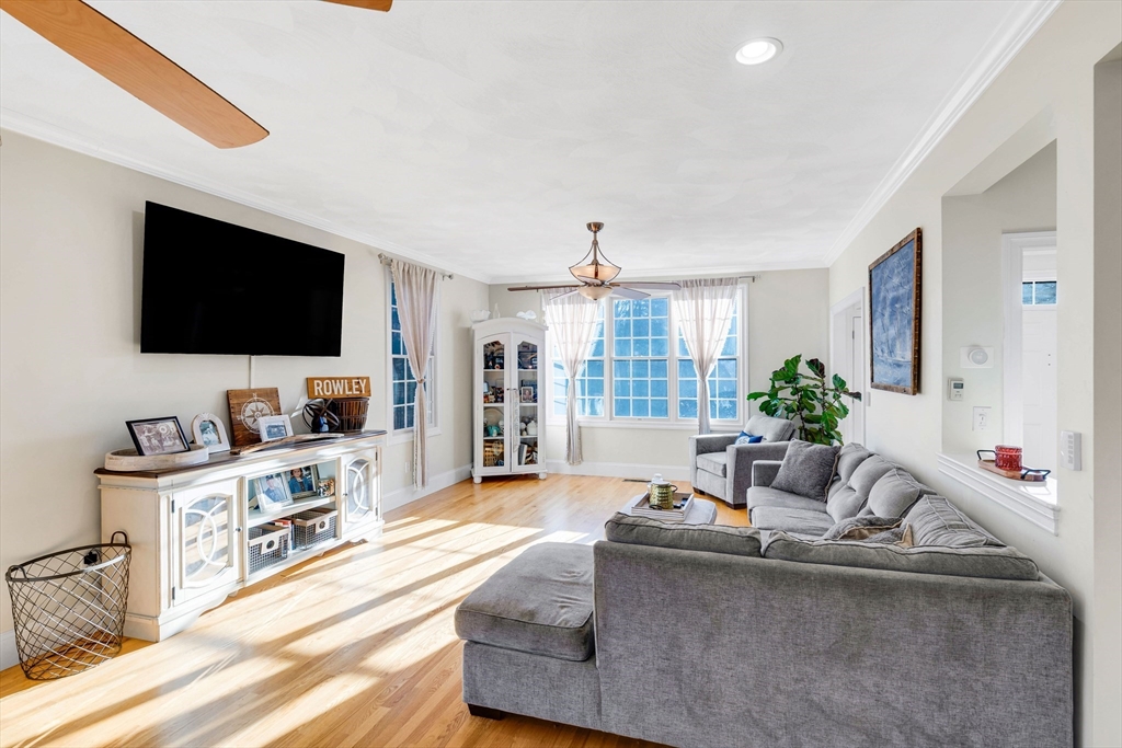 53 Emily Lane Rowley, MA 01969 - Photo 4 of 42 a living room with furniture and a flat screen tv