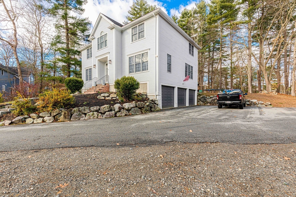 53 Emily Lane Rowley, MA 01969 - Photo 41 of 42 a view of a white house with a street