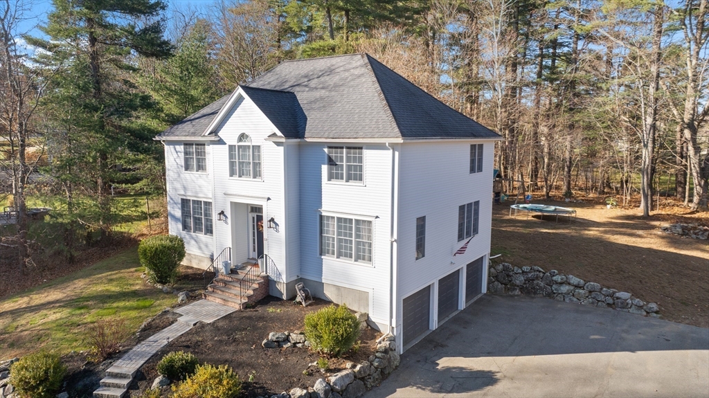 53 Emily Lane Rowley, MA 01969 - Photo 42 of 42 a front view of a house with a yard