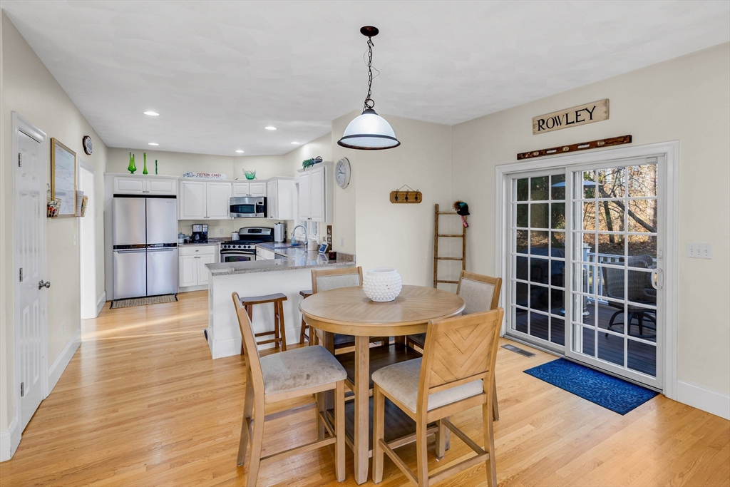 53 Emily Lane Rowley, MA 01969 - Photo 8 of 42 a view of a dining room with furniture wooden floor and chandelier