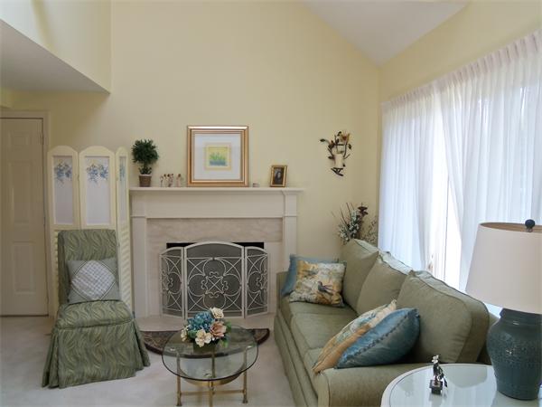 34 Monomoscoy Road Mashpee, MA 02649 - Photo 11 of 16 a living room with furniture and a fireplace