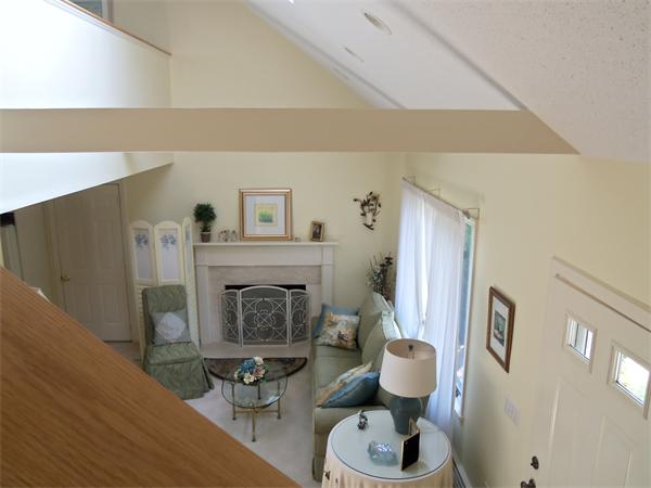34 Monomoscoy Road Mashpee, MA 02649 - Photo 12 of 16 a living room with furniture and a fireplace