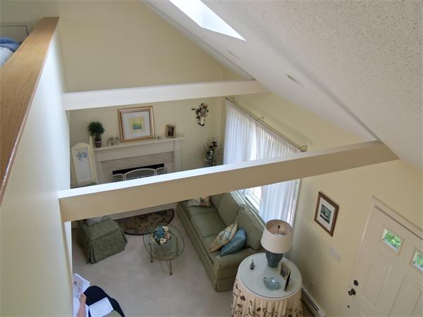 34 Monomoscoy Road Mashpee, MA 02649 - Photo 15 of 16 a living room with furniture and a chair
