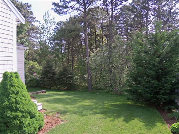 34 Monomoscoy Road Mashpee, MA 02649 - Photo 2 of 16 a view of a yard