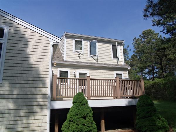 34 Monomoscoy Road Mashpee, MA 02649 - Photo 4 of 16 a view of a house with a deck