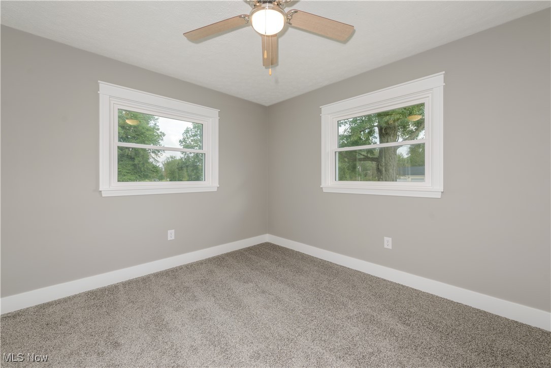 4761 Waterloo Road Atwater, OH 44201 - Photo 14 of 45 2nd bedroom, ceiling fan, trim, baseboard, closet doors and carpet