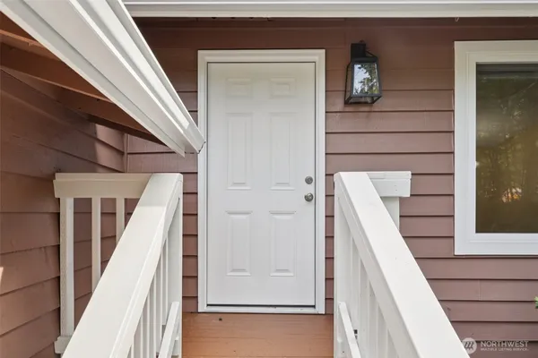 a view of staircase with railing and stairs