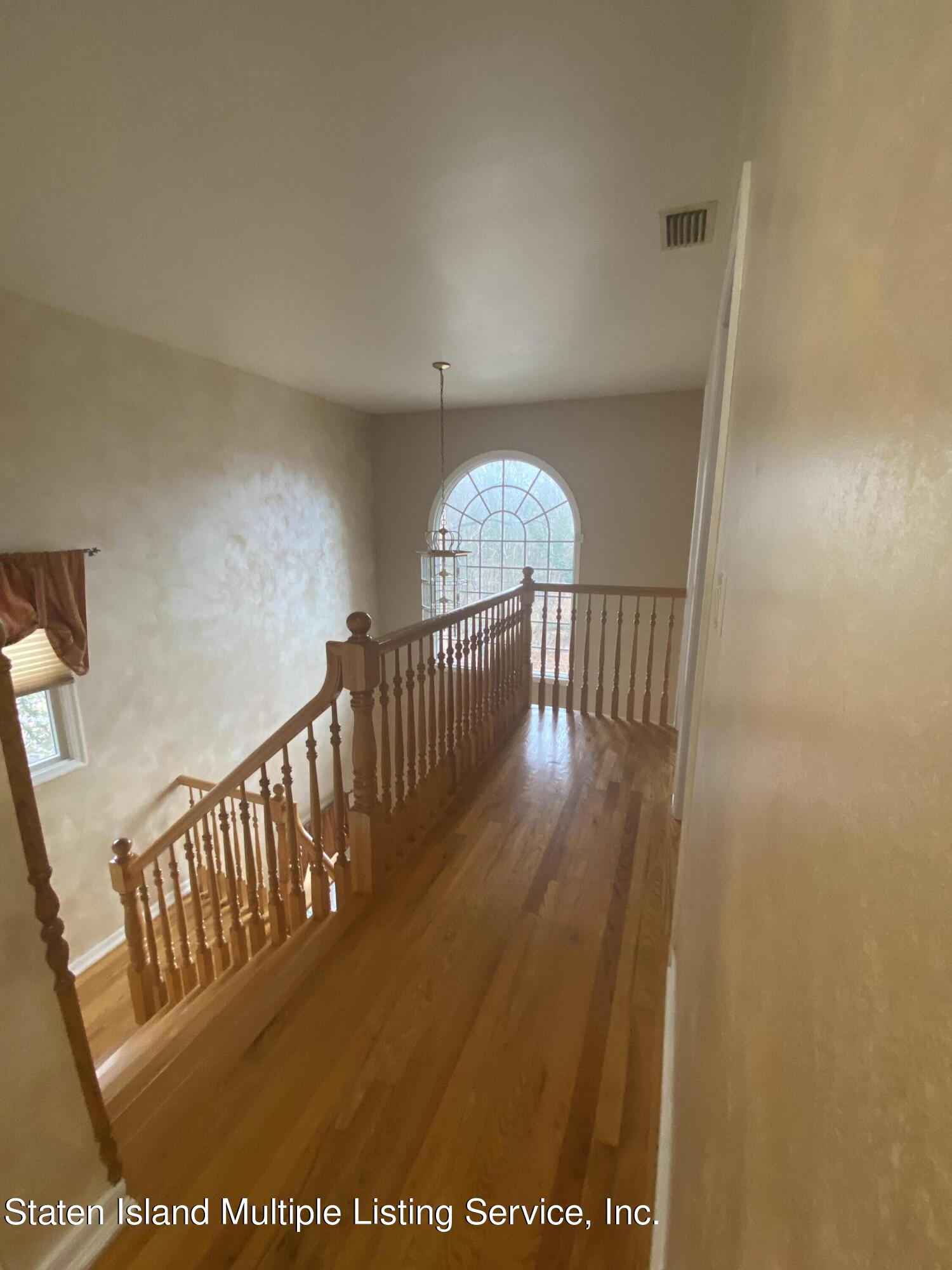 373 St George Road Staten Island, NY 10306 - Photo 11 of 25 HALLWAY UPSTAIRS OVERLOOKING FOYER