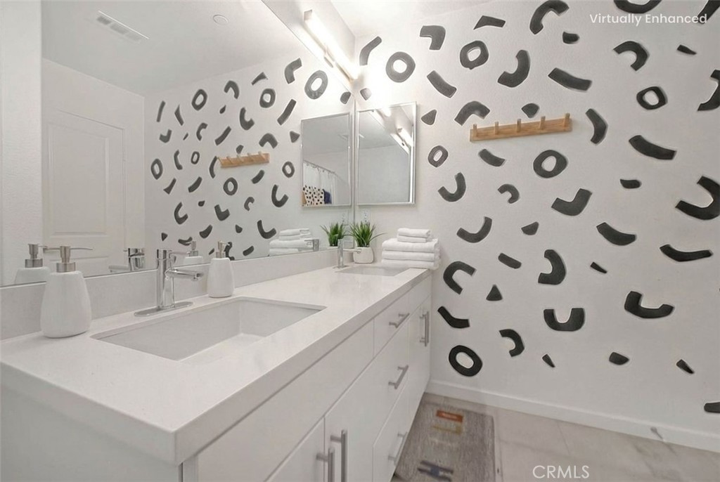 9412 Shade Place Rancho Cucamonga, CA 91730 - Photo 13 of 31 a bathroom with a sink and a mirror