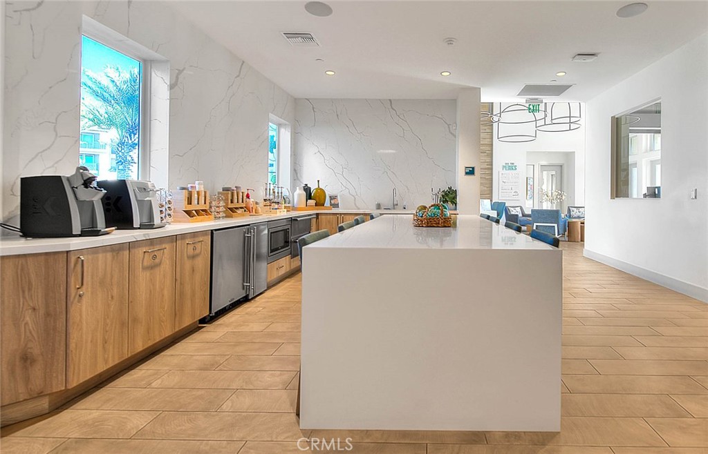 9412 Shade Place Rancho Cucamonga, CA 91730 - Photo 18 of 31 a kitchen with cabinets a sink and appliances