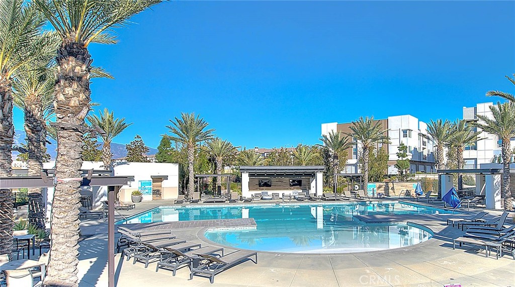 9412 Shade Place Rancho Cucamonga, CA 91730 - Photo 22 of 31 a view of a swimming pool with a patio