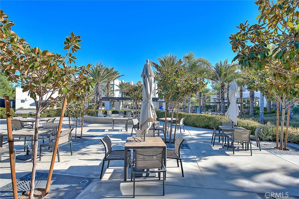 9412 Shade Place Rancho Cucamonga, CA 91730 - Photo 28 of 31 a view of a patio with dining table and chairs with wooden floor and plants