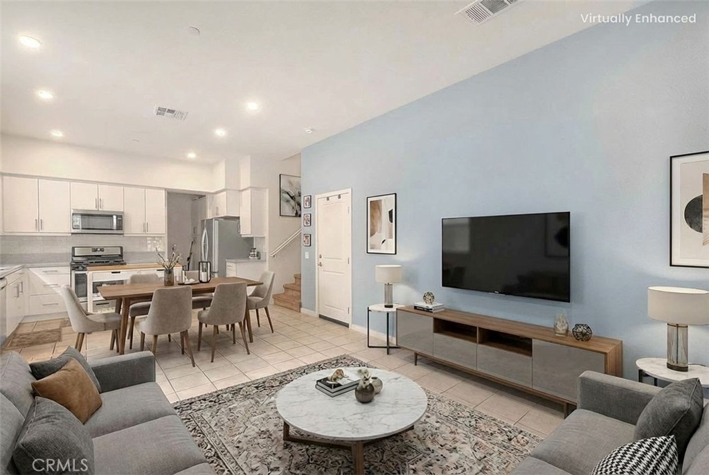 9412 Shade Place Rancho Cucamonga, CA 91730 - Photo 3 of 31 a living room with furniture and a flat screen tv