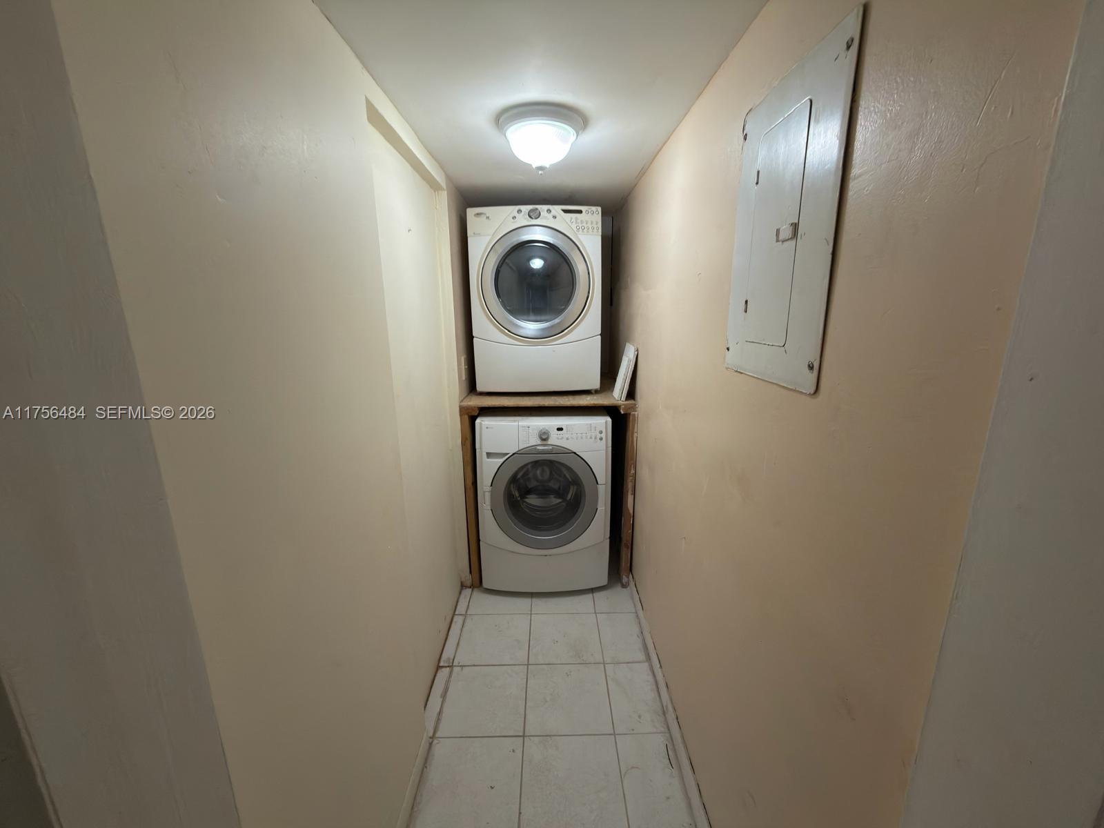 3400 Foxcroft Road, Unit 212 Miramar, FL 33025 - Photo 16 of 22 a close up view of a washer and dryer in a utility room
