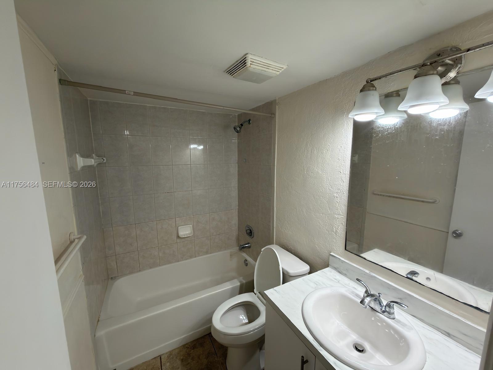 3400 Foxcroft Road, Unit 212 Miramar, FL 33025 - Photo 19 of 22 a bathroom with a sink toilet and shower