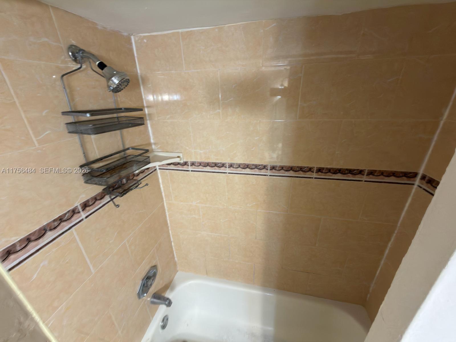 3400 Foxcroft Road, Unit 212 Miramar, FL 33025 - Photo 22 of 22 a bathroom with a shower