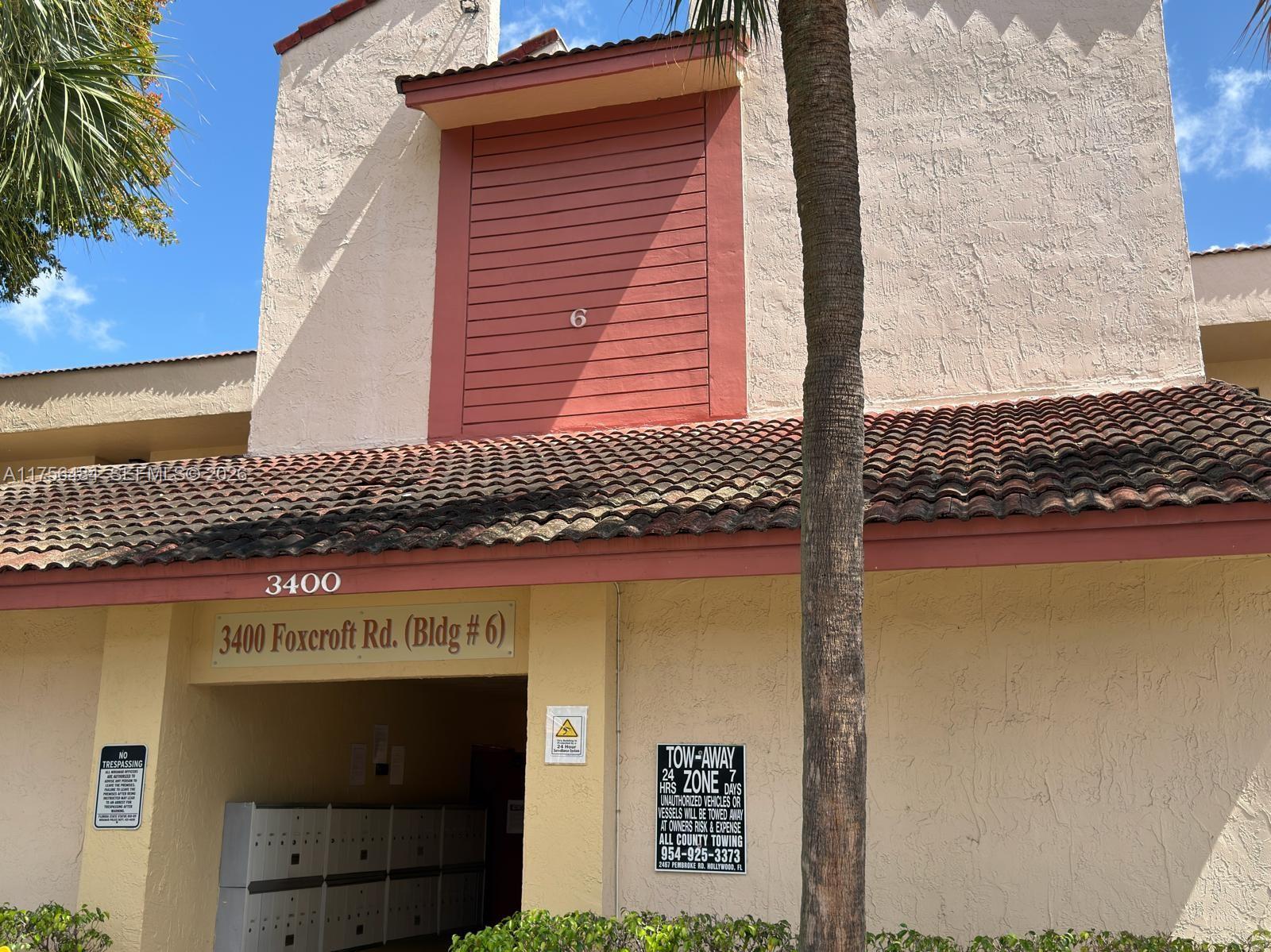 3400 Foxcroft Road, Unit 212 Miramar, FL 33025 - Photo 6 of 22 a sign on the side of a building