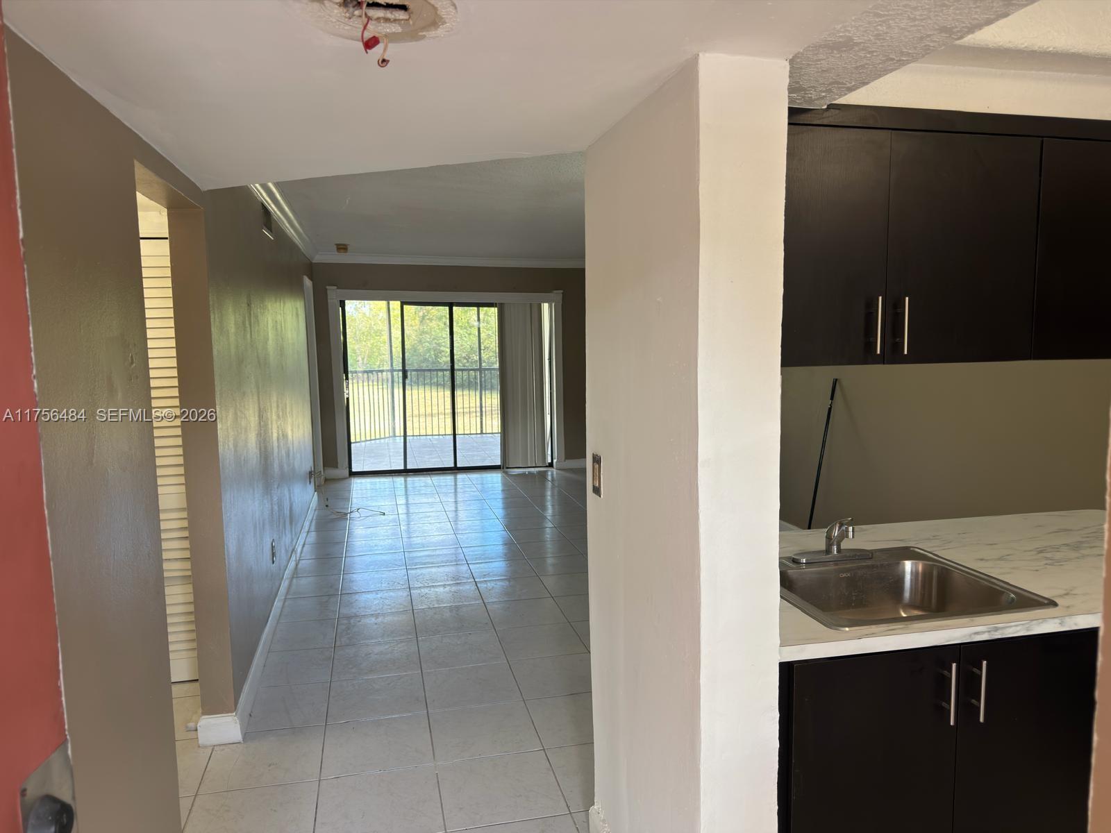 3400 Foxcroft Road, Unit 212 Miramar, FL 33025 - Photo 7 of 22 a view of a kitchen with a sink and a window
