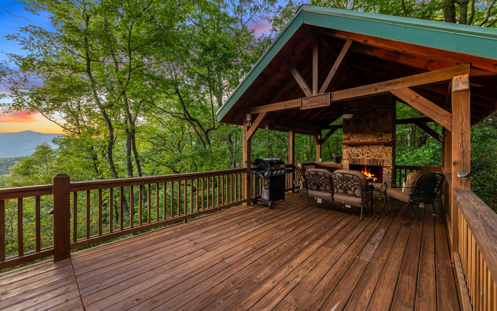 29 Maggie Chapman Road Blue Ridge, GA 30513 - Photo 34 of 40 a view of a roof deck with table and chairs under an umbrella with wooden floor