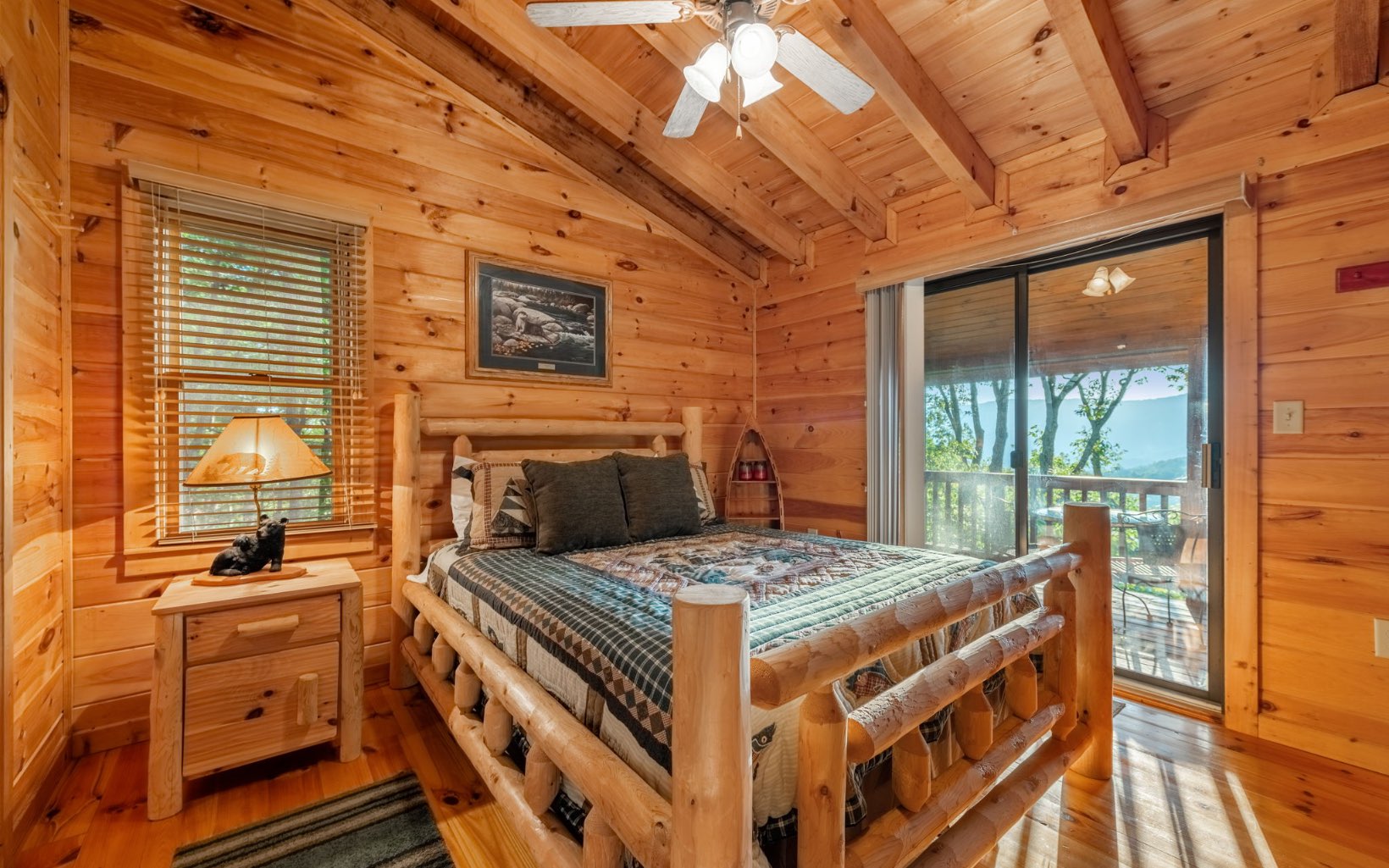 29 Maggie Chapman Road Blue Ridge, GA 30513 - Photo 6 of 40 a bedroom with a bed and wooden floor
