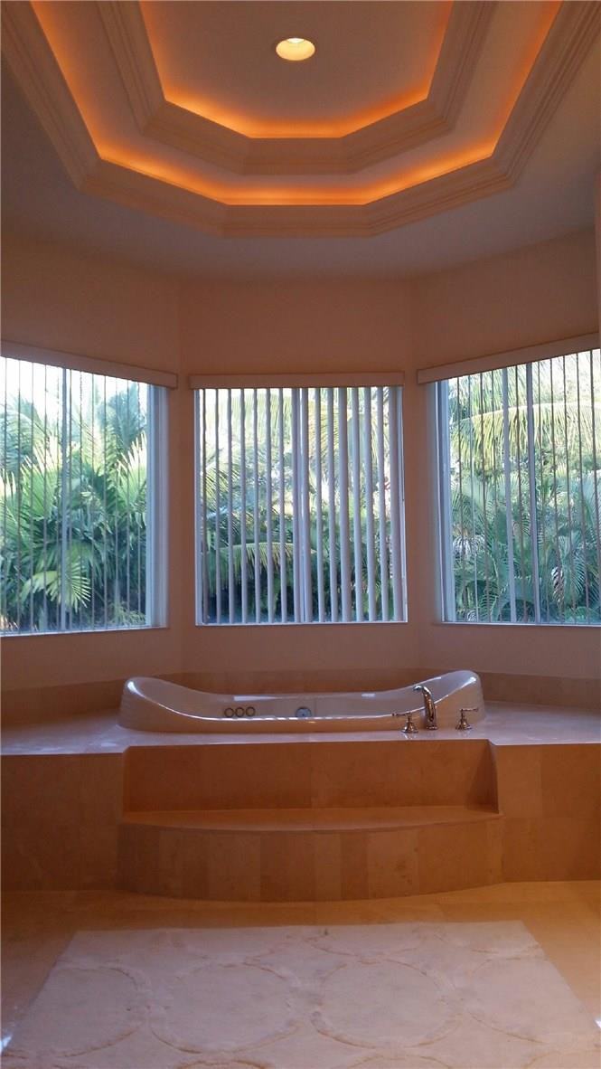 17665 Middlebrook Way Boca Raton, FL 33496 - Photo 12 of 17 a bathroom with a bathtub and window