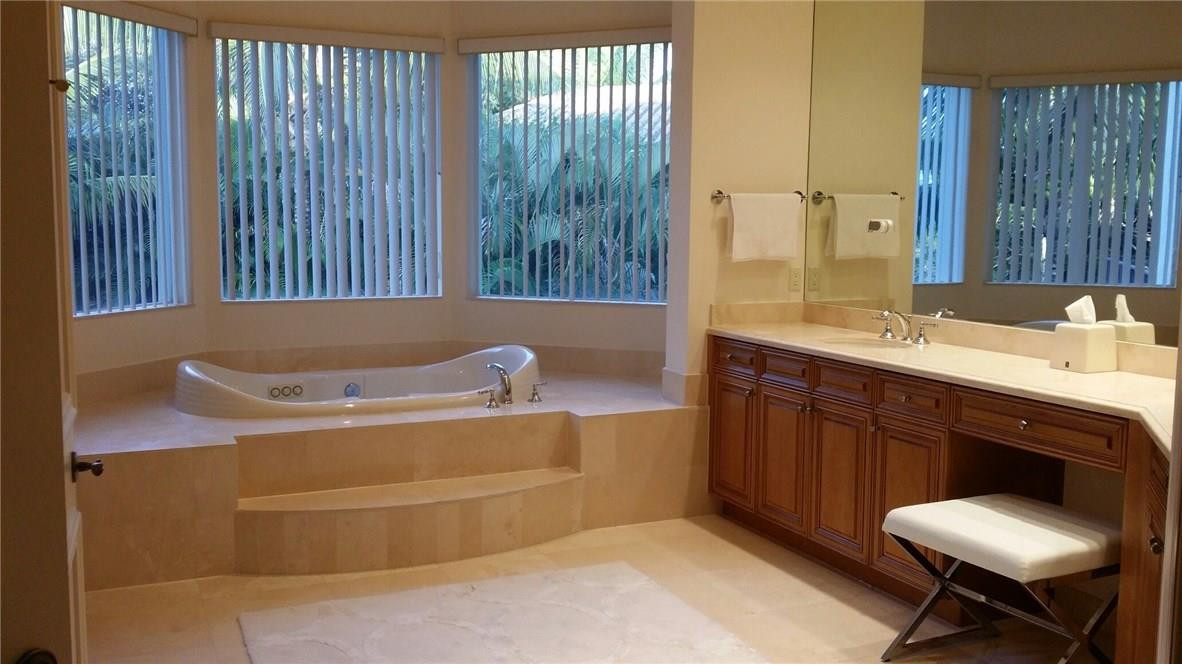 17665 Middlebrook Way Boca Raton, FL 33496 - Photo 13 of 17 a bathroom with a tub sink and mirror