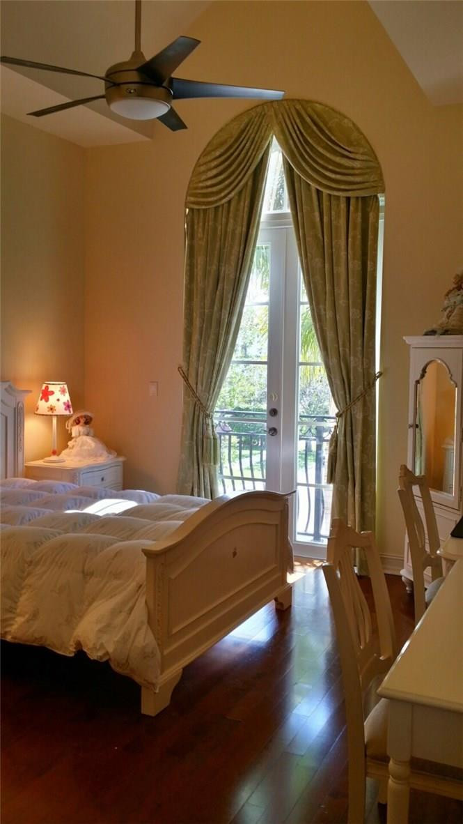 17665 Middlebrook Way Boca Raton, FL 33496 - Photo 7 of 17 a bedroom with a bed and large windows