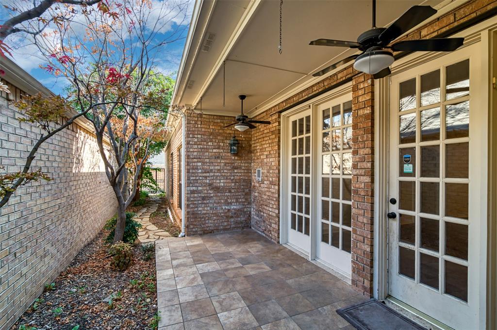 5920 Encore Drive Dallas, TX 75240 - Photo 33 of 34 Covered patio featuring tiled flooring and dual ceiling fans