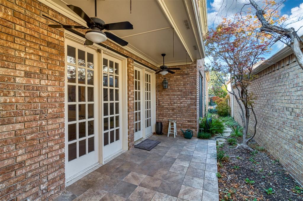 5920 Encore Drive Dallas, TX 75240 - Photo 34 of 34 Covered patio featuring two sets of French doors, brick exterior, ceiling fans, and tiled flooring