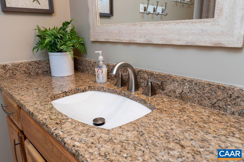 2035 Stone Ridge Wintergreen, VA 22967 - Photo 29 of 51 a bathroom with a granite countertop sink and a granite top