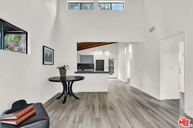 a view of a livingroom with furniture and wooden floor