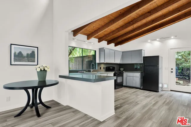 a kitchen with a table and chairs in it