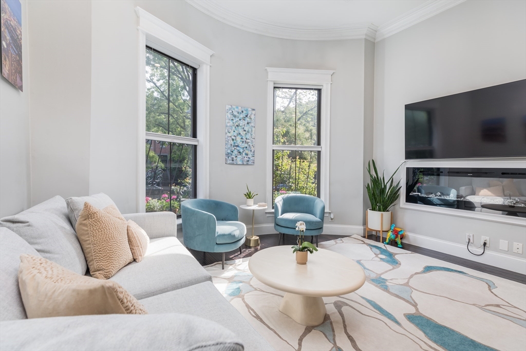 21 Worcester Square, Unit 2 Boston, MA 02118 - Photo 1 of 23 a living room with furniture and a flat screen tv