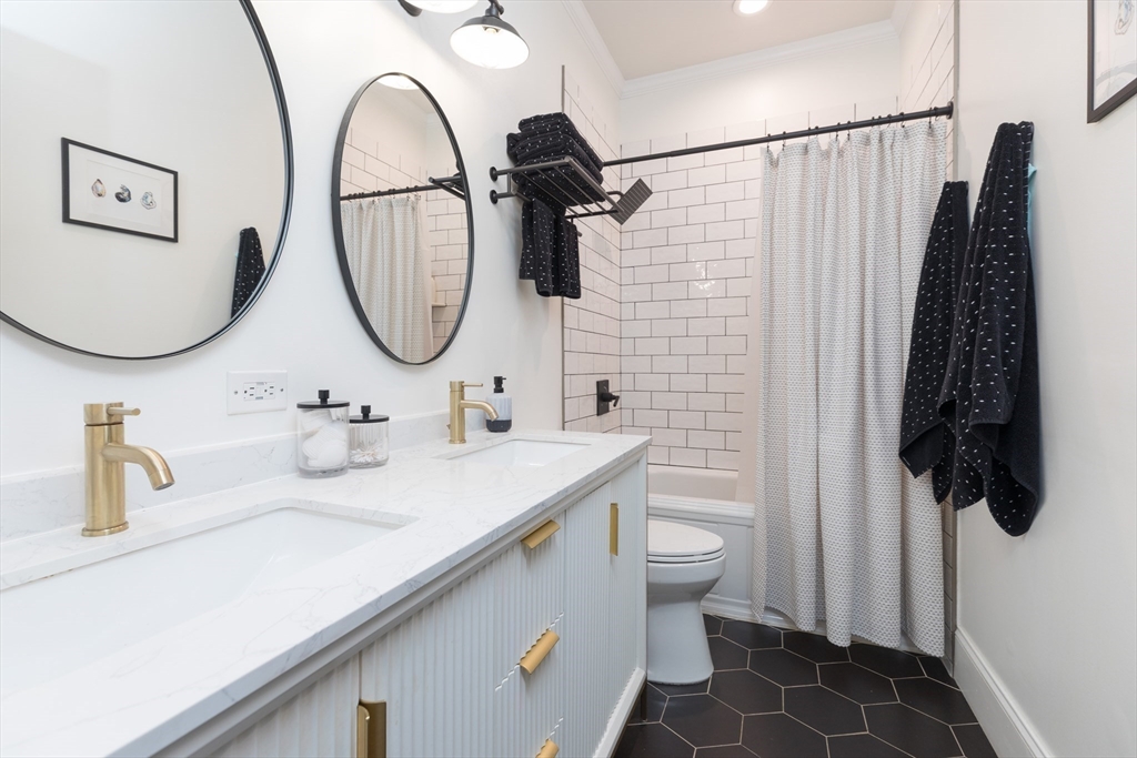21 Worcester Square, Unit 2 Boston, MA 02118 - Photo 11 of 23 a bathroom with a sink and a mirror