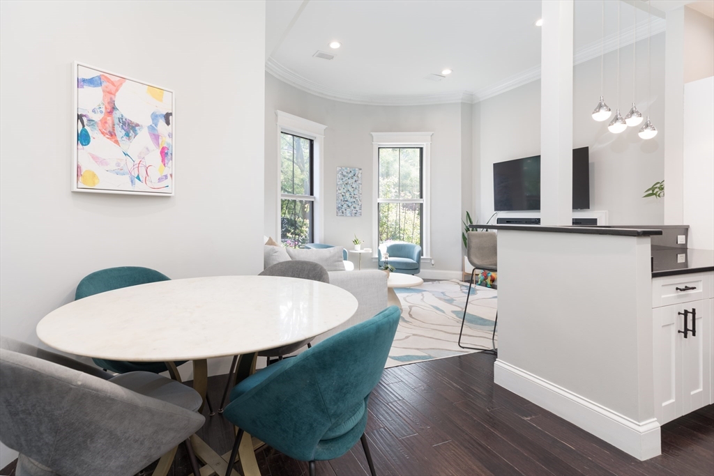 21 Worcester Square, Unit 2 Boston, MA 02118 - Photo 5 of 23 a view of a dining room with furniture and wooden floor