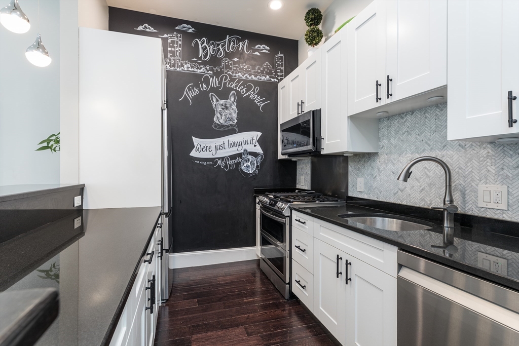 21 Worcester Square, Unit 2 Boston, MA 02118 - Photo 9 of 23 a kitchen with granite countertop a refrigerator and a stove