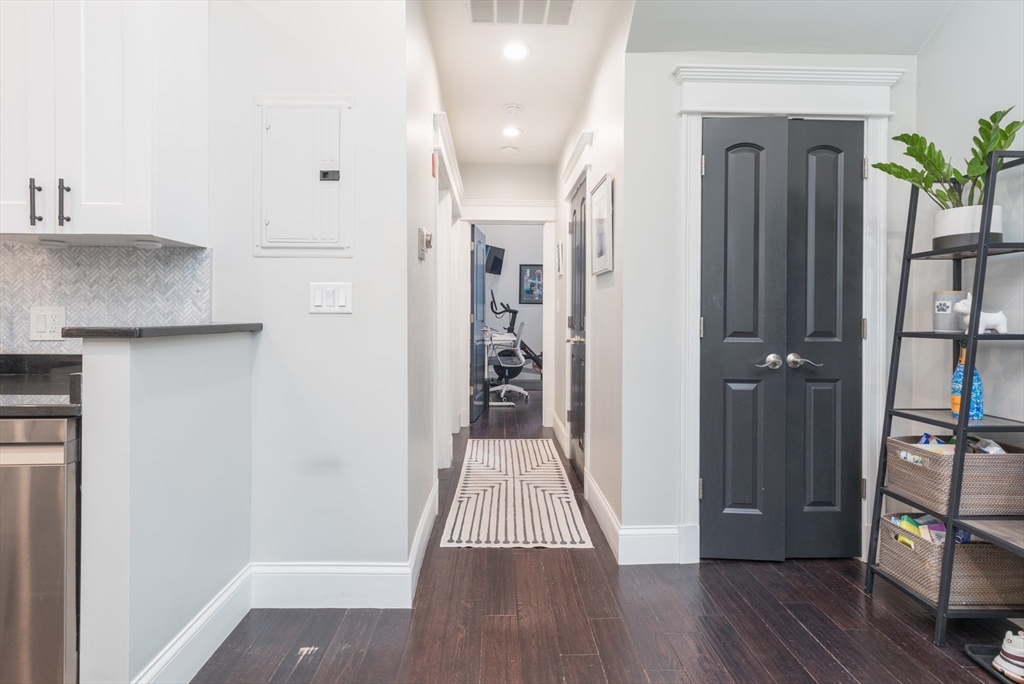 21 Worcester Square, Unit 2 Boston, MA 02118 - Photo 10 of 23 a view of a hallway with wooden floor and stairs