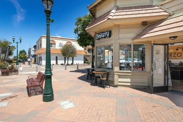 a outdoor space with lots of potted plants