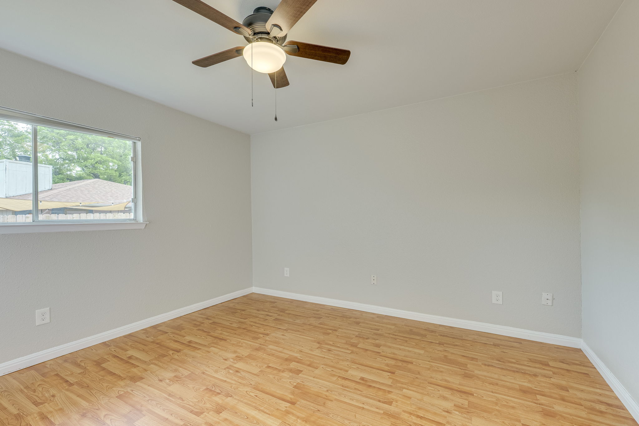 4815 Transit Circle Austin, TX 78727 - Photo 21 of 35 This bedroom overlooks the backyard through a large window, bringing in great natural light and a peaceful view.