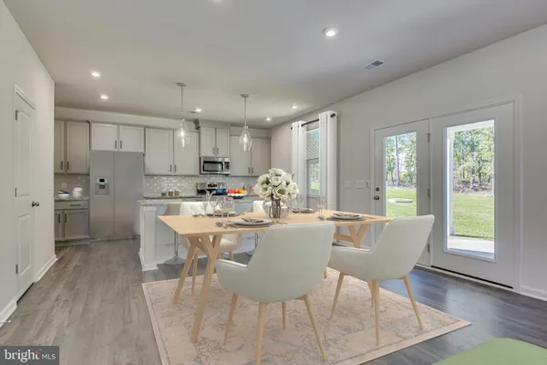 a bedroom with a bed and a chair in it