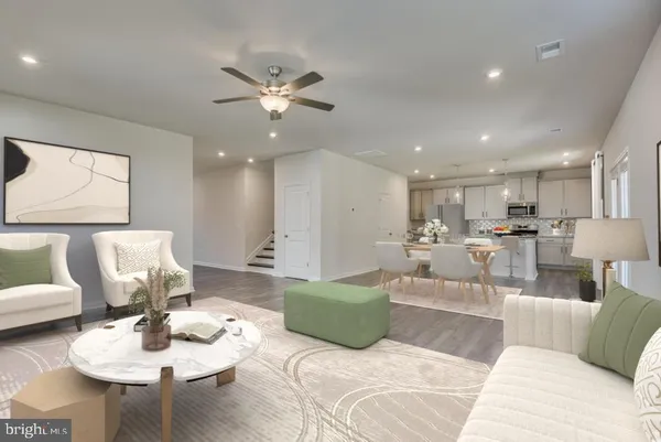 a bedroom with a bed and a mirror on dresser