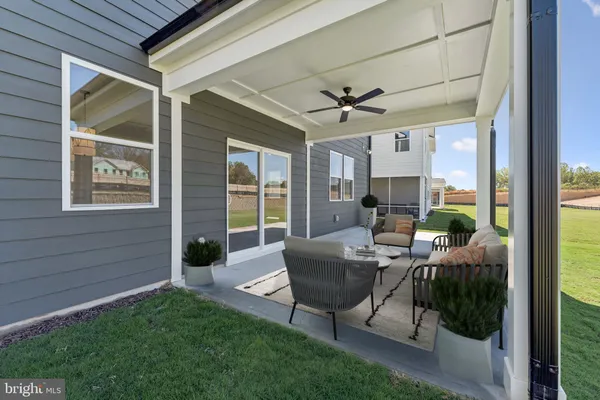 a bathroom with a granite countertop sink toilet mirror and shower